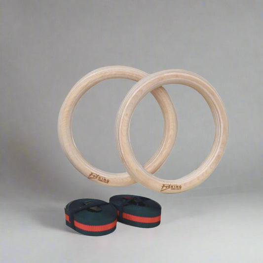 Two wooden gymnastic rings with straps on a white background, featuring the Fit King brand.